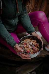 Midsection of woman holding ice cream