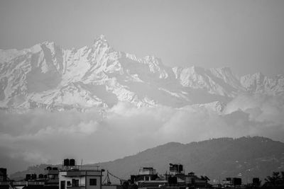 Scenic view of snowcapped mountains against sky