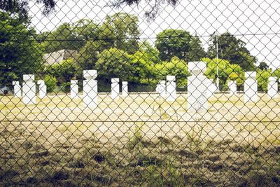 Fence seen through chainlink fence