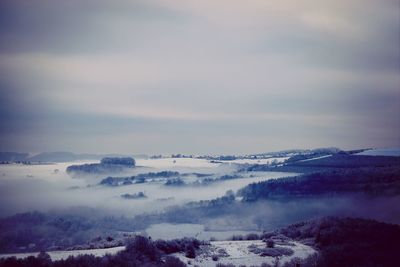 Scenic view of snow covered mountains