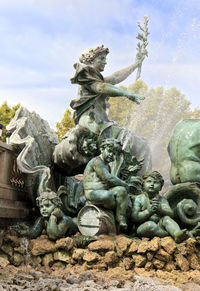 Low angle view of statue against sky