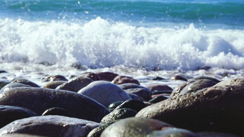 Close-up of stones on beach