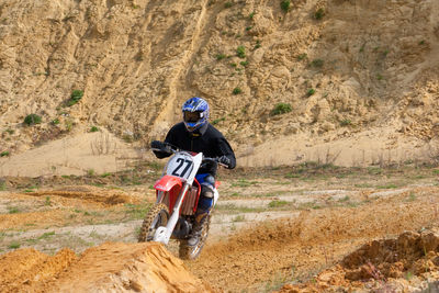 Man riding motorcycle on road