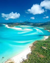 Scenic view of beach against blue sky