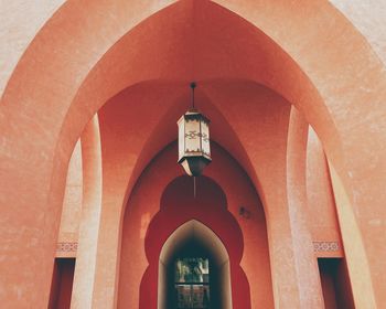 Low angle view of illuminated lanterns hanging in building