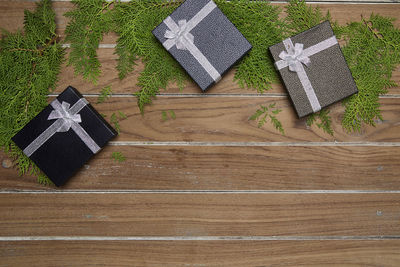 Gift boxes and christmas decorations on table