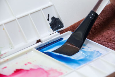 High angle view of paintbrushes on table