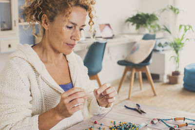 Young woman using digital tablet at home