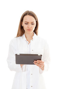 Young man holding laptop over white background