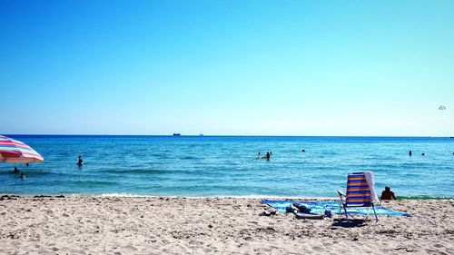 Scenic view of sea against clear blue sky