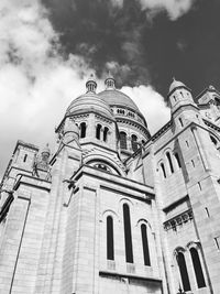 Low angle view of historic building against cloudy sky