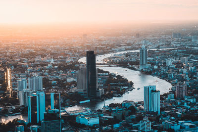 High angle view of city buildings during sunset