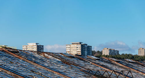 Low angle view of buildings against blue sky