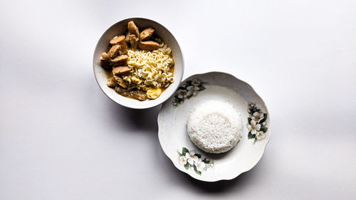 High angle view of food in bowl on white background