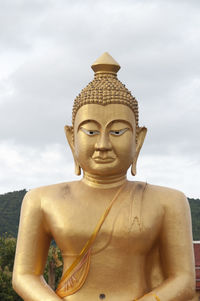 Low angle view of statue against sky