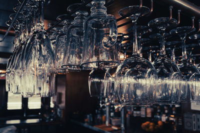 Upside down image of lanterns hanging from metal bar