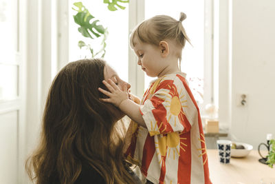 Side view of girl at home