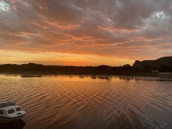 Scenic view of lake against sky during sunset