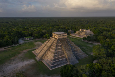 Aerial view of maya ruins of chichen itza in mystic twilight at evening.