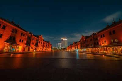 Illuminated buildings in city at night