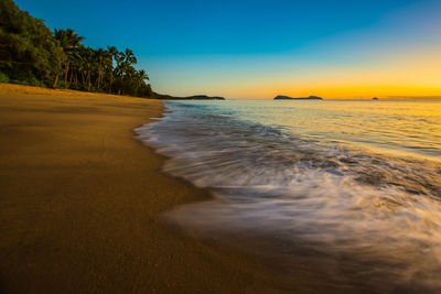 Scenic view of sea at sunset