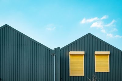 Factory building against blue sky