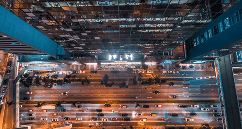 High angle view of crowd in illuminated city at night