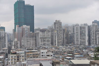 Modern buildings in city against sky