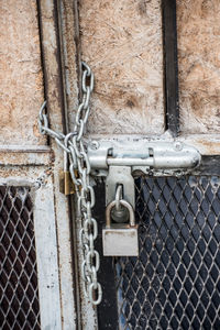 Close-up of padlock on metallic door