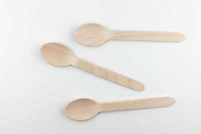 High angle view of wooden spoon on white background