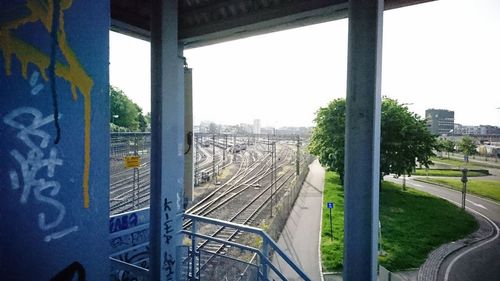 Train on railroad tracks against clear sky