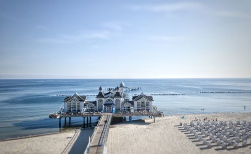 View of calm beach against blue sky