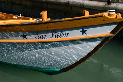 Close-up of boat moored in water