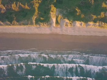 Scenic view of waterfall in mountains