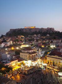 High angle shot of illuminated buildings against clear sky