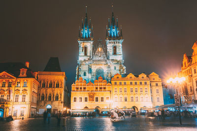 Illuminated buildings in city at night