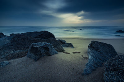 Scenic view of sea against sky at sunset