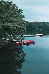 Boat moored on river against sky