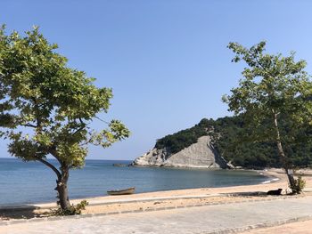 Scenic view of sea against clear blue sky