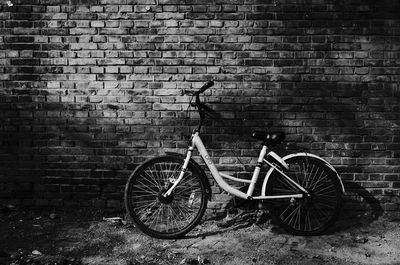 Bicycle against brick wall