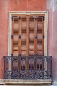 Closed metal window on wall of building