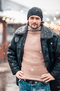 Man in city during snowfall