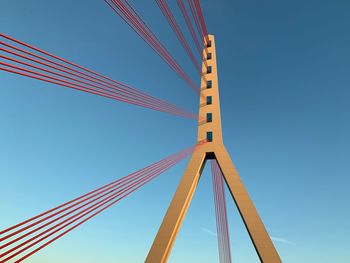 Low angle view of bridge against clear blue sky