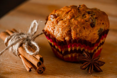 Delicious homemade muffins with raisins. christmas baking on a wooden background.