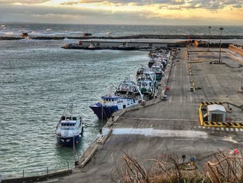 High angle view of sailboats moored on sea against sky