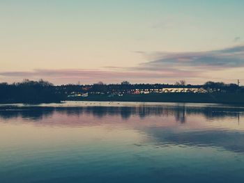 Scenic view of lake against sky during sunset