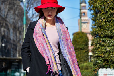 Woman wearing hat standing outdoors