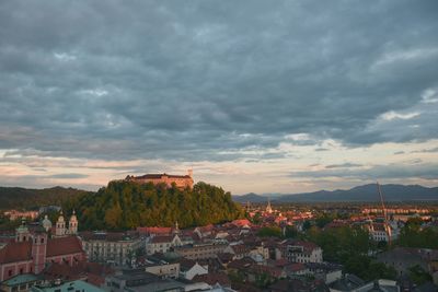 Cityscape against cloudy sky