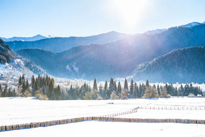 Scenic view of snowcapped mountains against sky