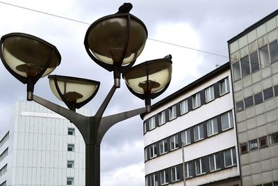 Low angle view of building against cloudy sky